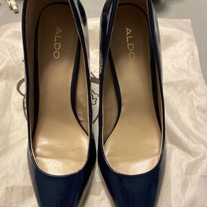 Size 8 Dark blue patent leather Aldo heels in like new condition.